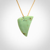 This is a lovely New Zealand Jade, pounamu niho drop pendant. It is bound with an adjustable beige coloured cord which is length adjustable.